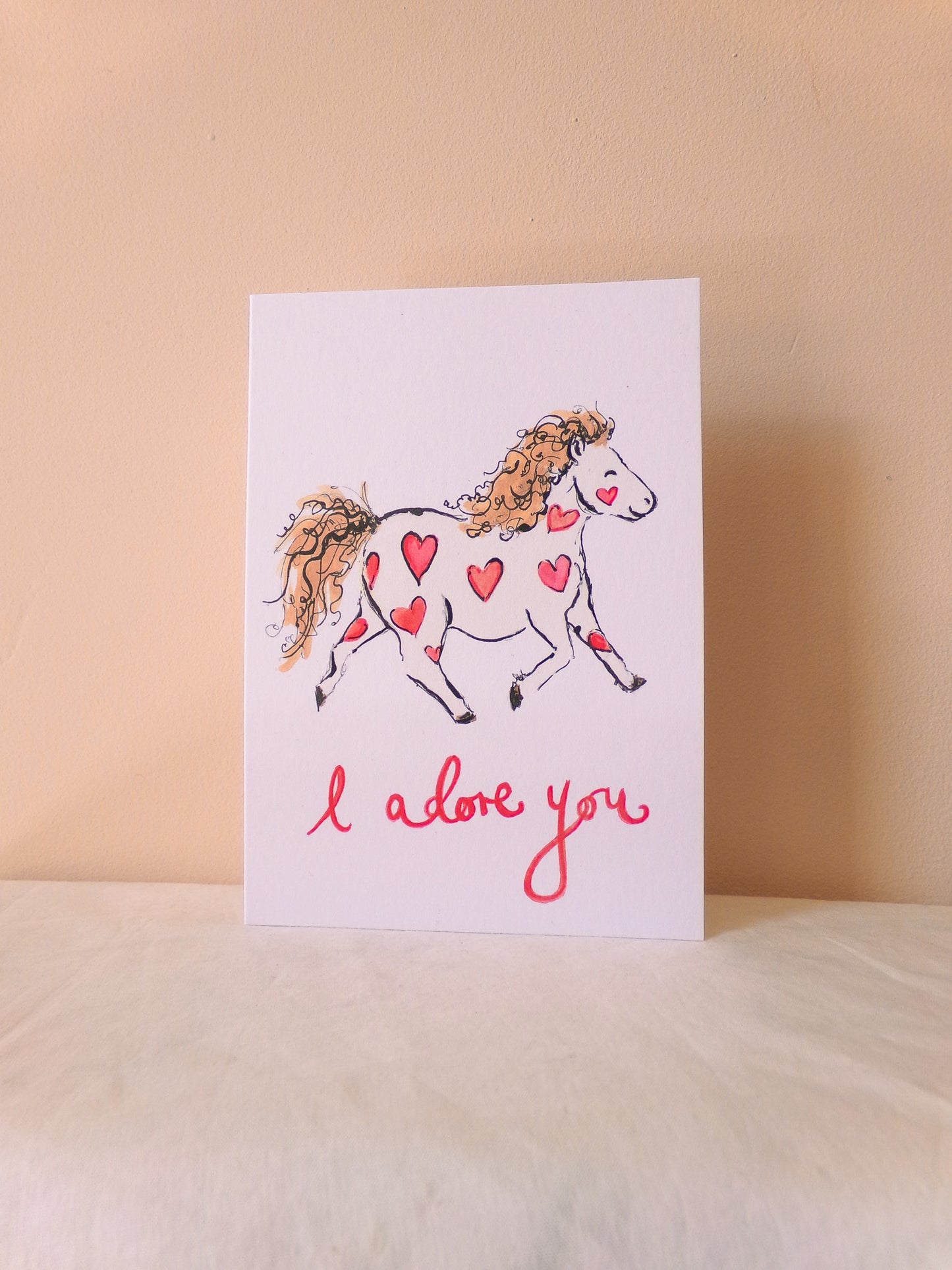 Card with a horse illustration and 'I love you' text on a beige background
