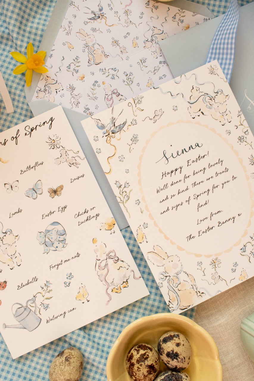 Set of Easter-themed greeting cards with illustrations on a checkered tablecloth.