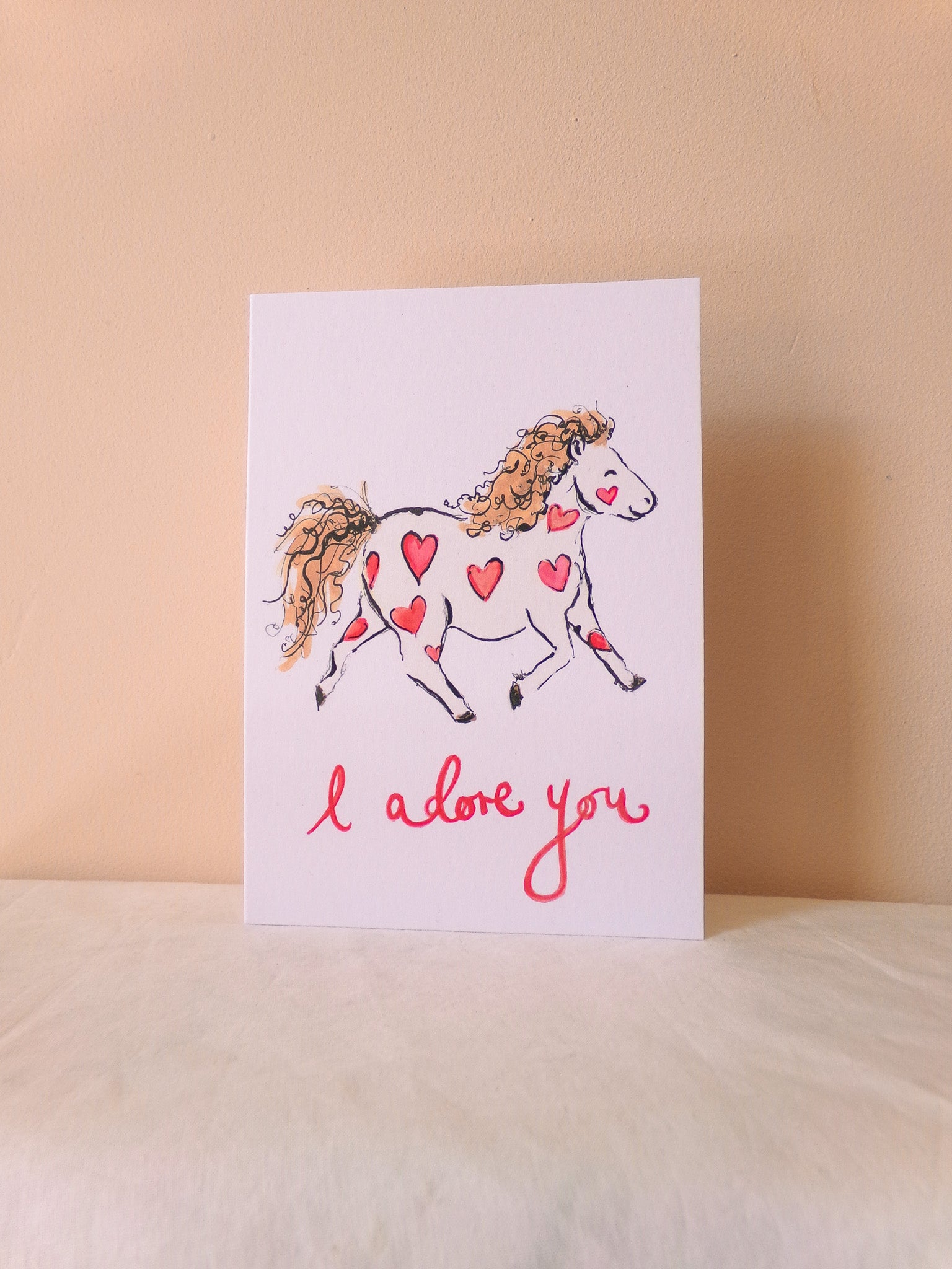 Card with a horse illustration and 'I love you' text on a beige background