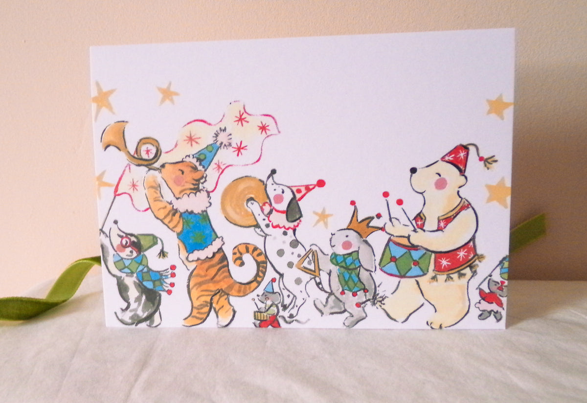 Cartoon animal band performing on a card with festive decorations.