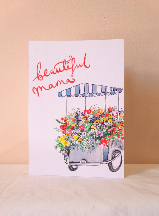 Greeting card with floral cart and 'beautiful mama' text on a beige background