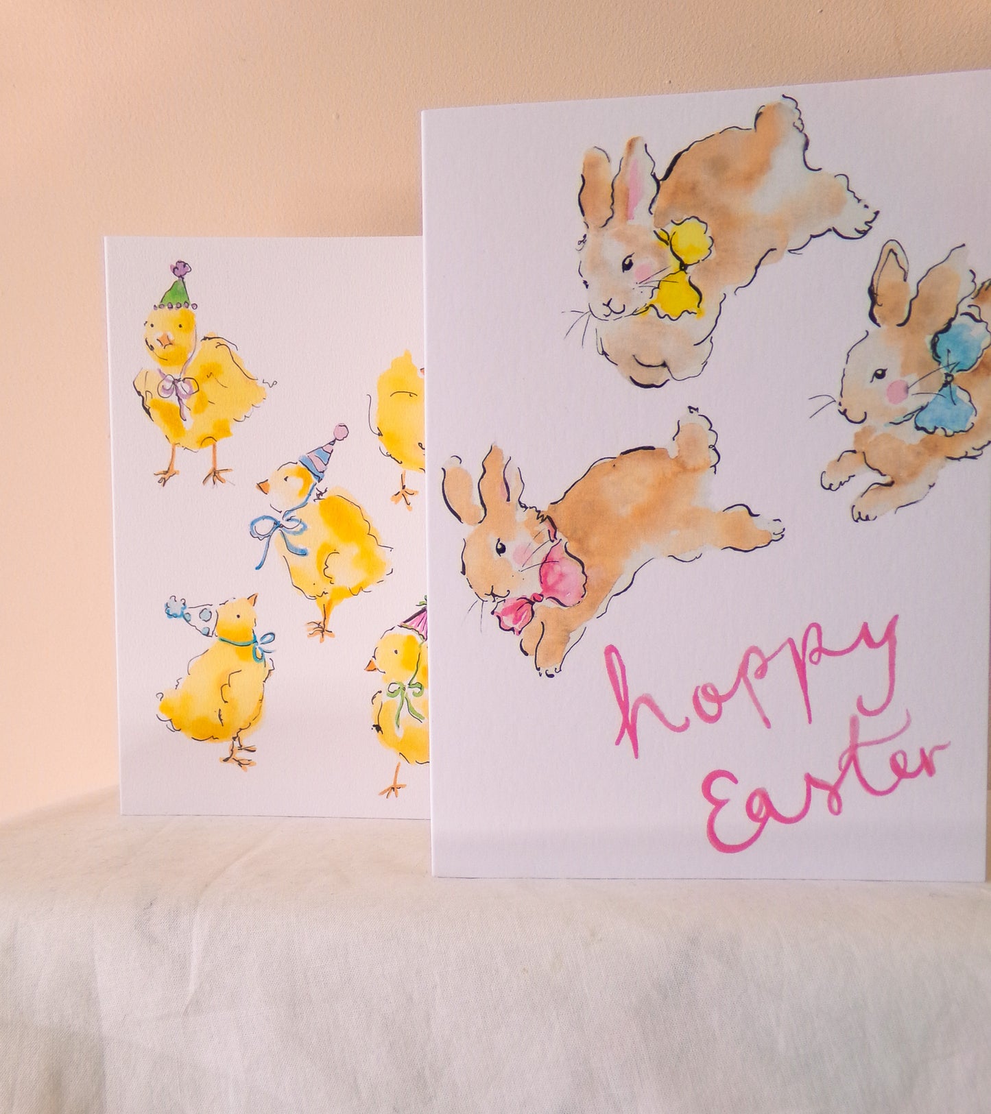 Two Easter-themed greeting cards with bunnies and chicks on a light background